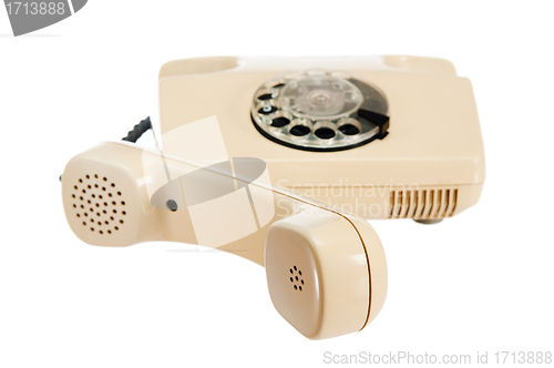 Image of Old analog phone with a disk, it is isolated on white