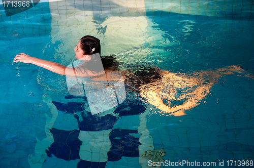 Image of Attractive girl in swimming pool