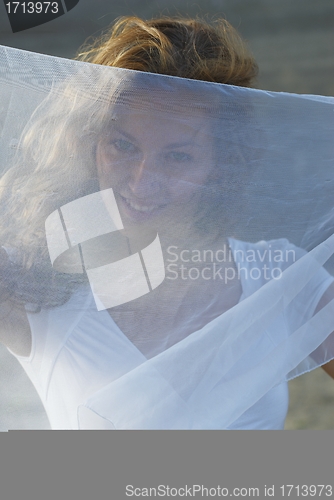 Image of Young woman with white scarf