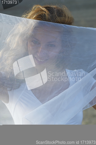 Image of Young woman with white scarf