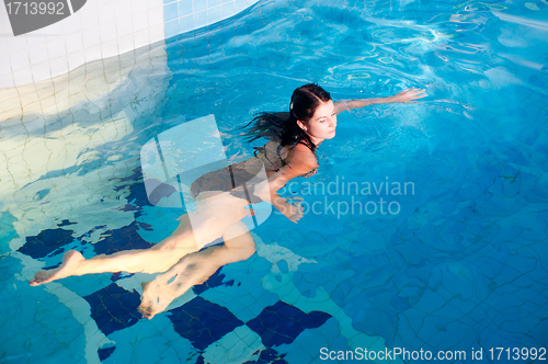 Image of Attractive girl in swimming pool
