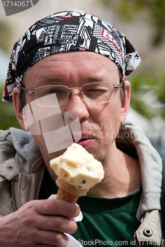 Image of portrait of man eating ice cream