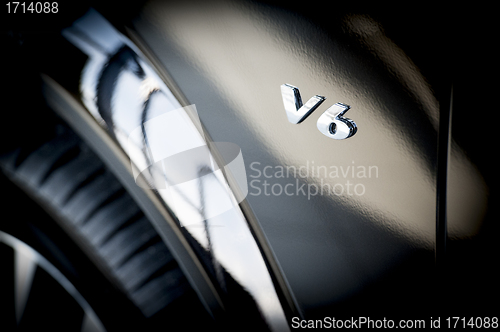 Image of V6 Emblem on side of new car