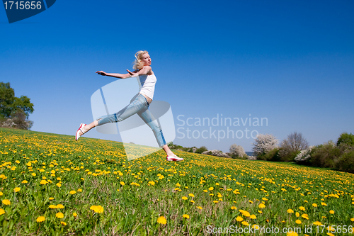 Image of happy young woman on meadow