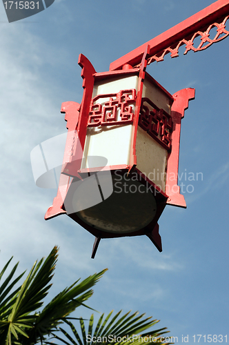 Image of Red lantern against blue sky