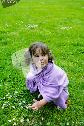 Image of beautiful girl playing on green grass, summer