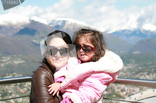 Image of Portrait of happy mother and her adorable little daughter 