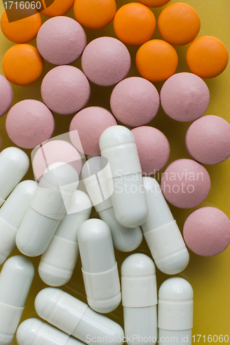 Image of White, pink and orange pills
