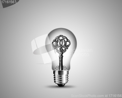 Image of Old key in light bulb