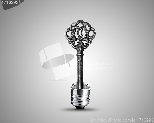 Image of Old key in light bulb