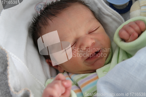Image of sweet baby sleeping on a blanket, newborn baby