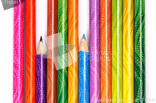Image of Assortment of coloured pencils with shadow on white background
