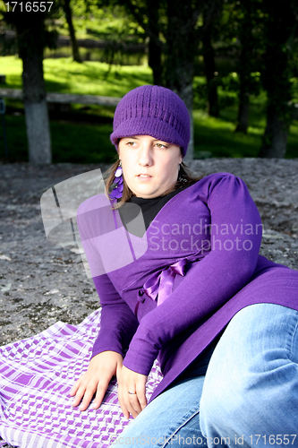 Image of  beautiful woman in an autumn park 