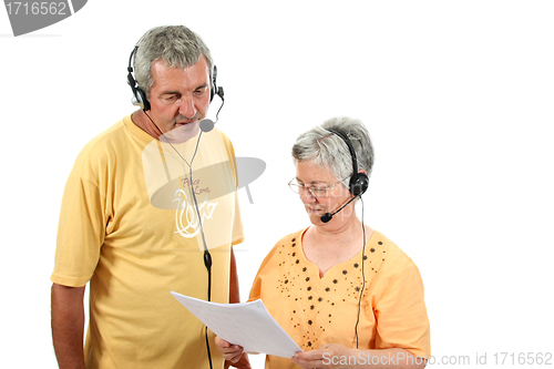 Image of mature couple in a business call center