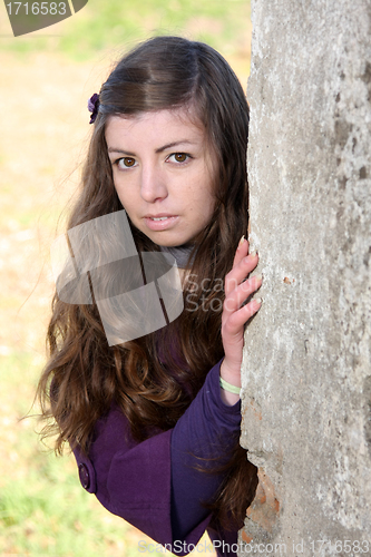 Image of  beautiful woman in an autumn park 