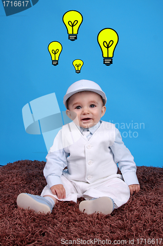 Image of Portrait of a happy baby boy Isolated on blue background having 
