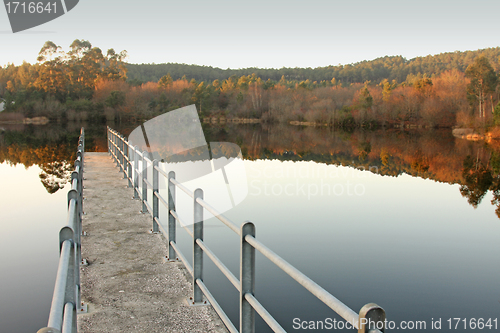 Image of beautiful autumn landscape with pier, river and reflex, Portugal