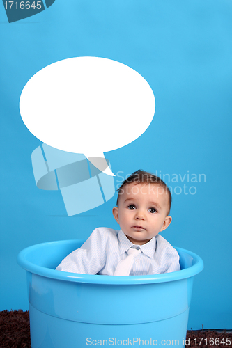 Image of baby on a blue bucket, studio shoot