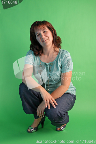 Image of fashion woman on green background. studio shot.