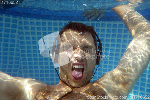 Image of man underwater listen music with head-phones