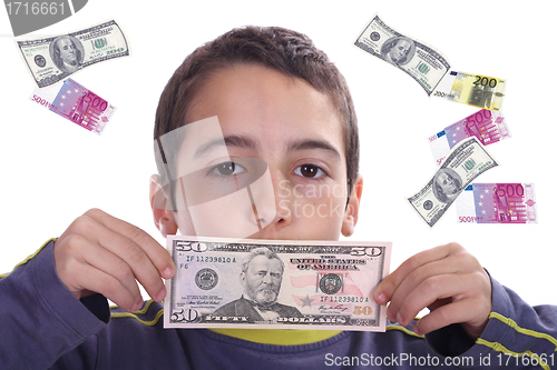 Image of boy with dolares and euros, business studio photo