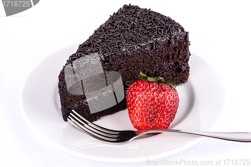 Image of Slice of chocolate cake with strawberries.