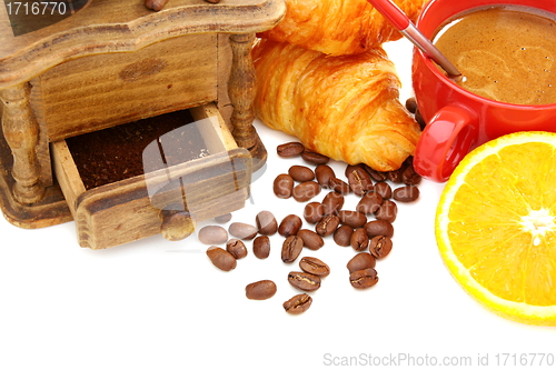 Image of Coffee, croissants and a mill.