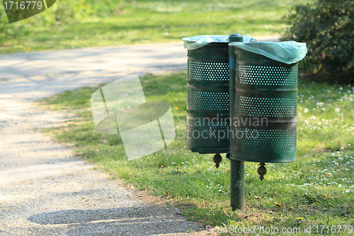 Image of two iron trash cans