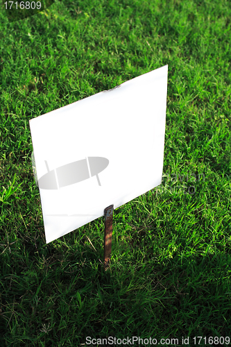 Image of signboard on green grass