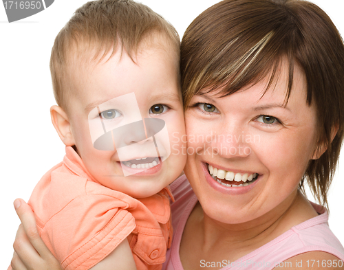 Image of Portrait of a mother hugging her son