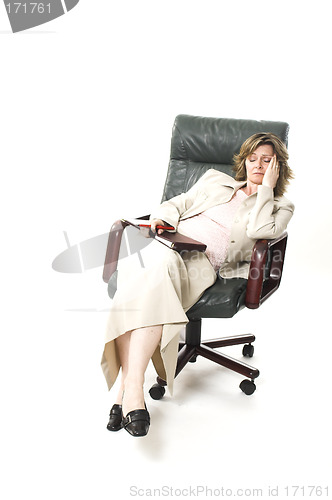 Image of business woman relaxing on chair