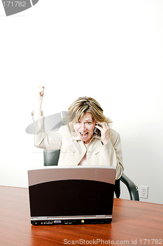 Image of business woman happy on cellphone