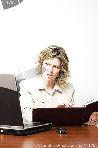 Image of business woman looking at laptop