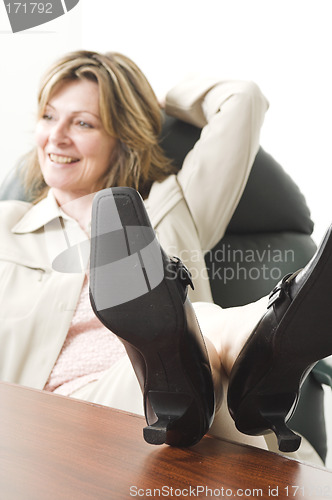 Image of business woman relaxing