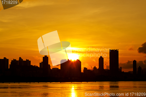 Image of City at sunset along the coast