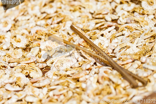 Image of Dried shrimps with chopsticks