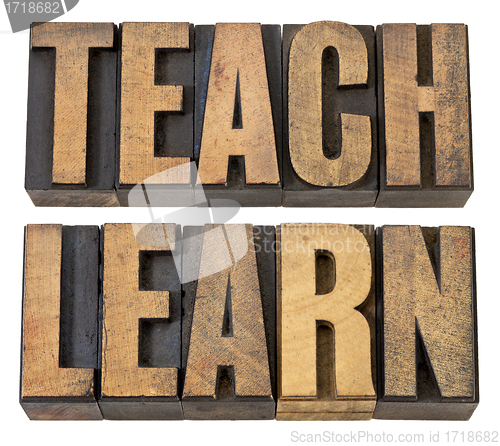 Image of teach. learn - words in wood type