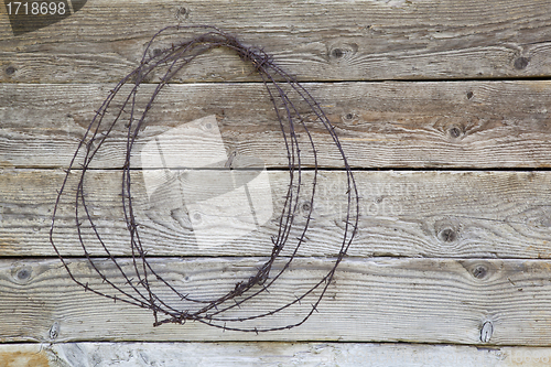 Image of rusty barbed wire coil