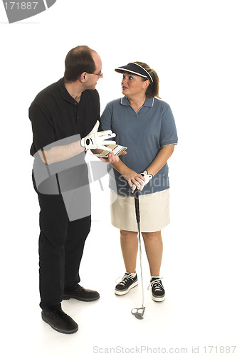 Image of couple playing golf