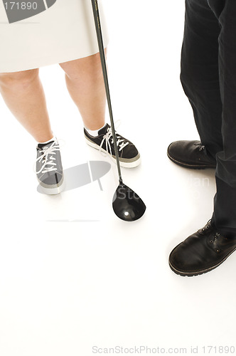 Image of couple with golf club