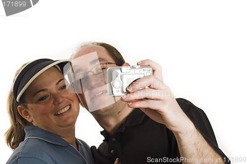 Image of couple taking pictures close up