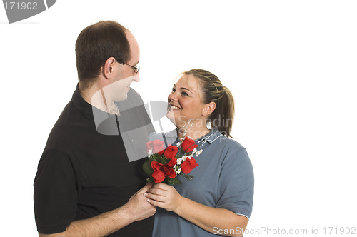 Image of couple sharing flowers