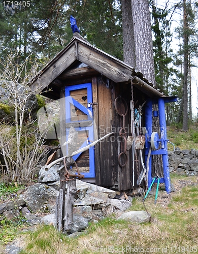 Image of Outhouse in blue and brown