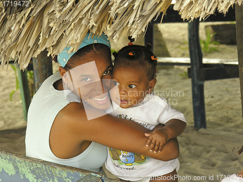 Image of Woman Embraces her Daughter on a Beach of Santo Domingo