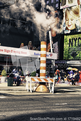 Image of New York City, NY - March 9: A Manhole throws out Smoke in Centr