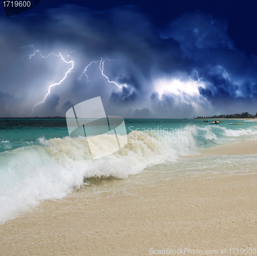 Image of Wave on the Beach with Storm in the Background