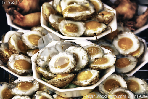 Image of Fried Eggs exposed inside a Thai Market