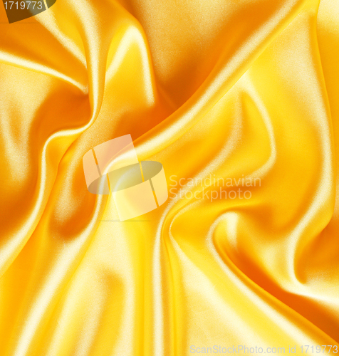 Image of Smooth elegant golden satin as background 