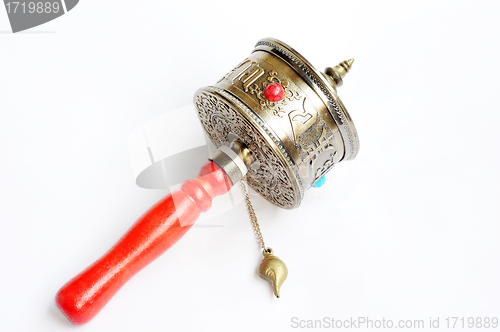 Image of Tibetan prayer wheel on a white background