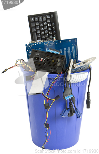 Image of electronic scrap in blue trash can